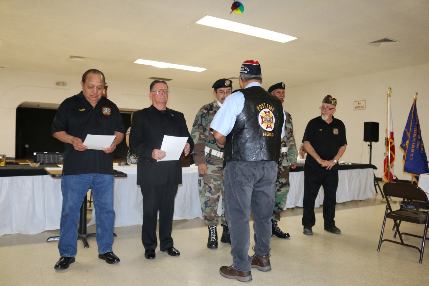 Commander Fernandez presents awards to the Post Honor Guard members.