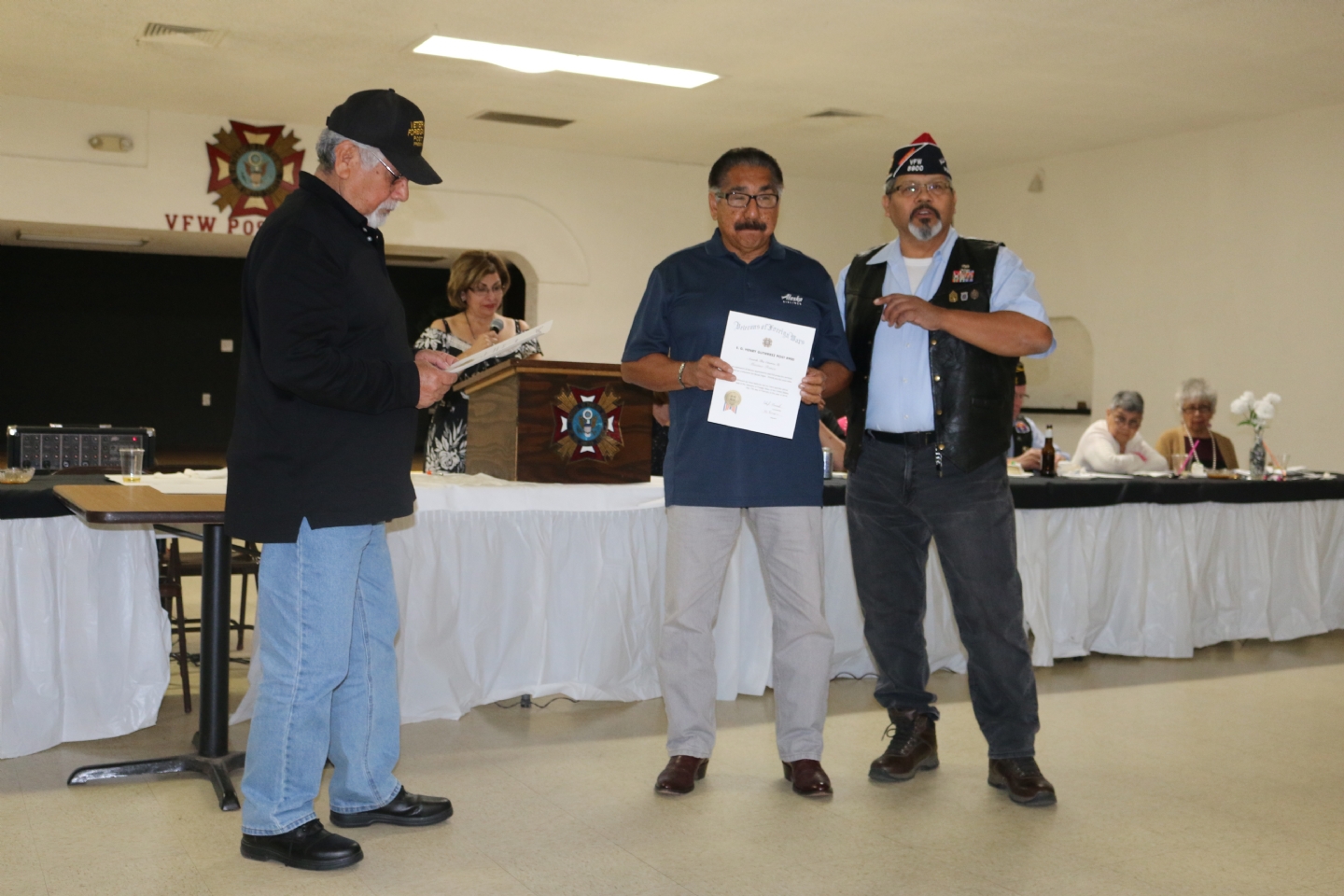 Commander Fernandez presents awards to Ralph Guerra and Max Franco for conducting the Post's Steak Nights in the Spring and Summer.