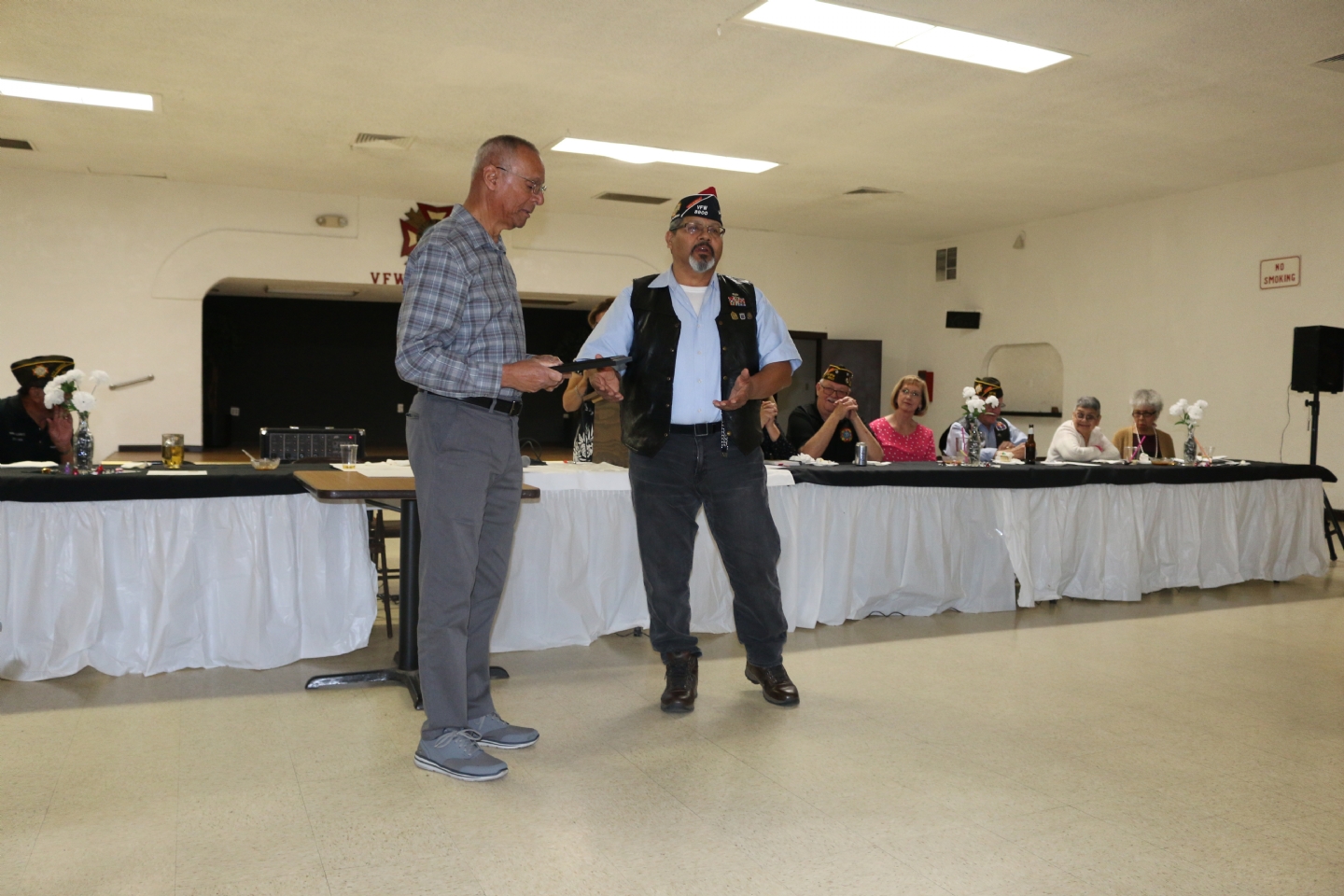 Commander Fernandez presents his Commander's Award to Vince Hogan.